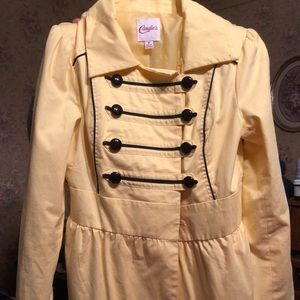 Candies yellow trench coat.